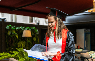 Successful graduate with diploma showcasing academic achievements and international opportunities through Avis Worldwide.